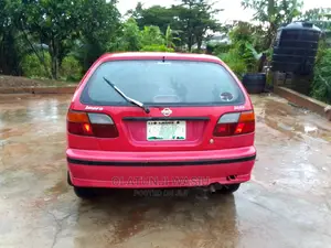 🚗 2021 Nissan Almera Red Sedan | Low Mileage in Ijebu Ode - Fuel Efficient & Well-Maintained - Image 3