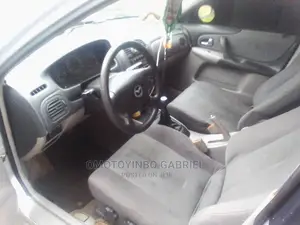 🚗 2003 Mazda 323 Compact Sedan | Available in Offa - Low Mileage & Spacious - Image 3